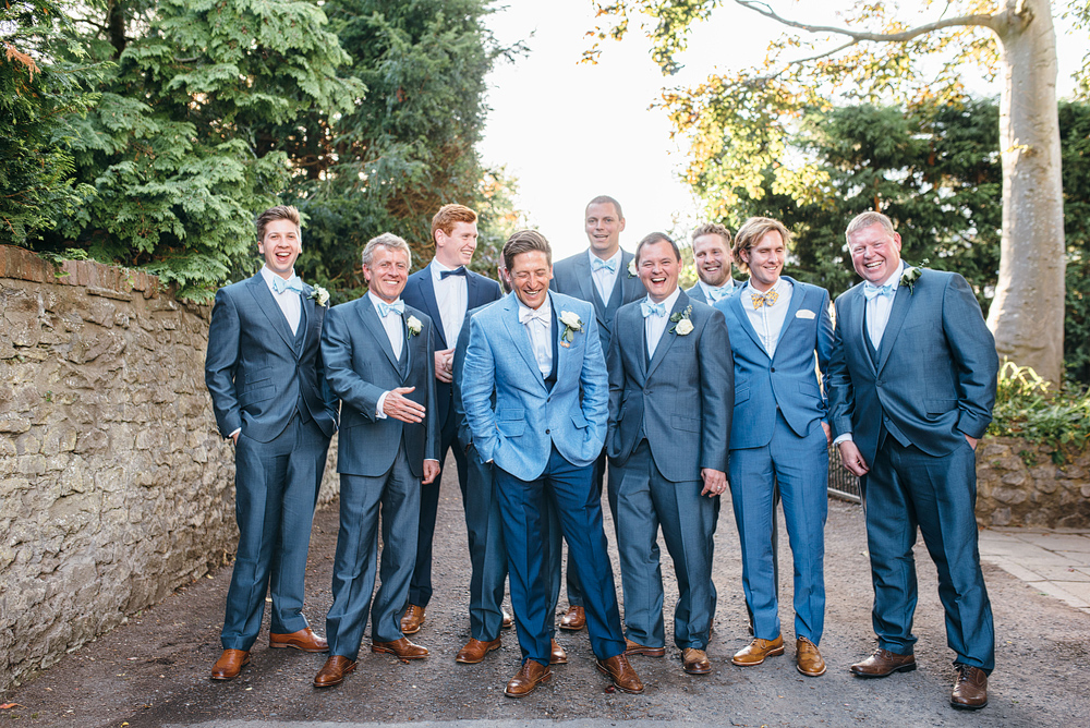 Bristol whimsical wedding. Groom and men in stylish blue outfits