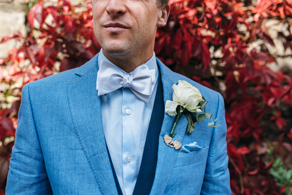groom in blue jacket and buttonhole. Stylish wedding ideas