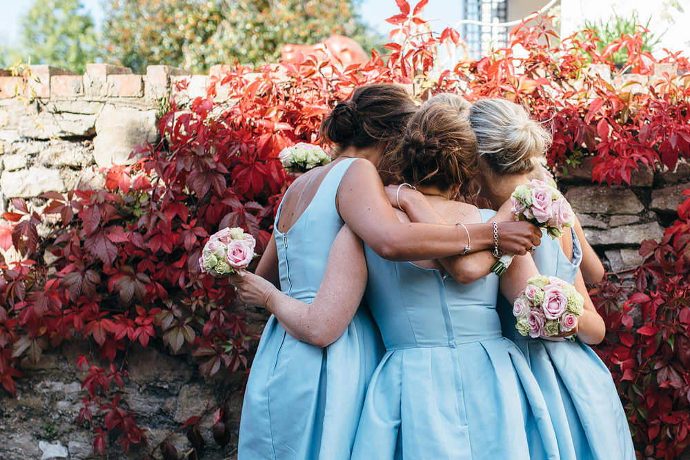 bridesmaids having a group hug
