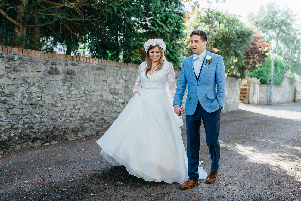 Bristol whimsical wedding bride and groom hand in hand
