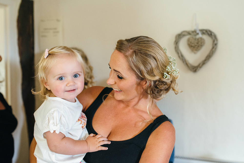 Bride and child smiling