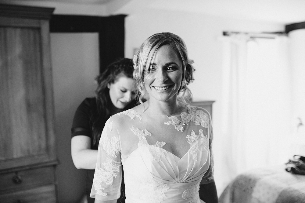 Bride smiling preparing for wedding ceremony