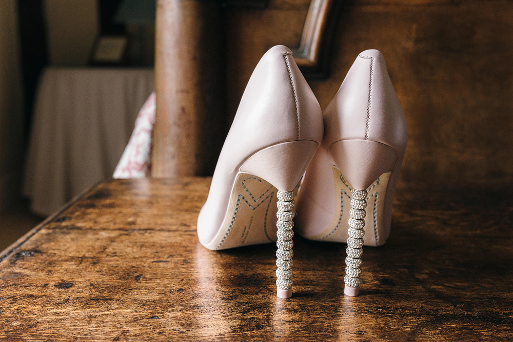 Bride's shoes on table