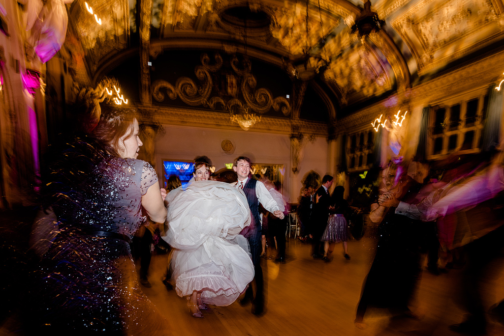 Blurry guests dancing at wedding reception