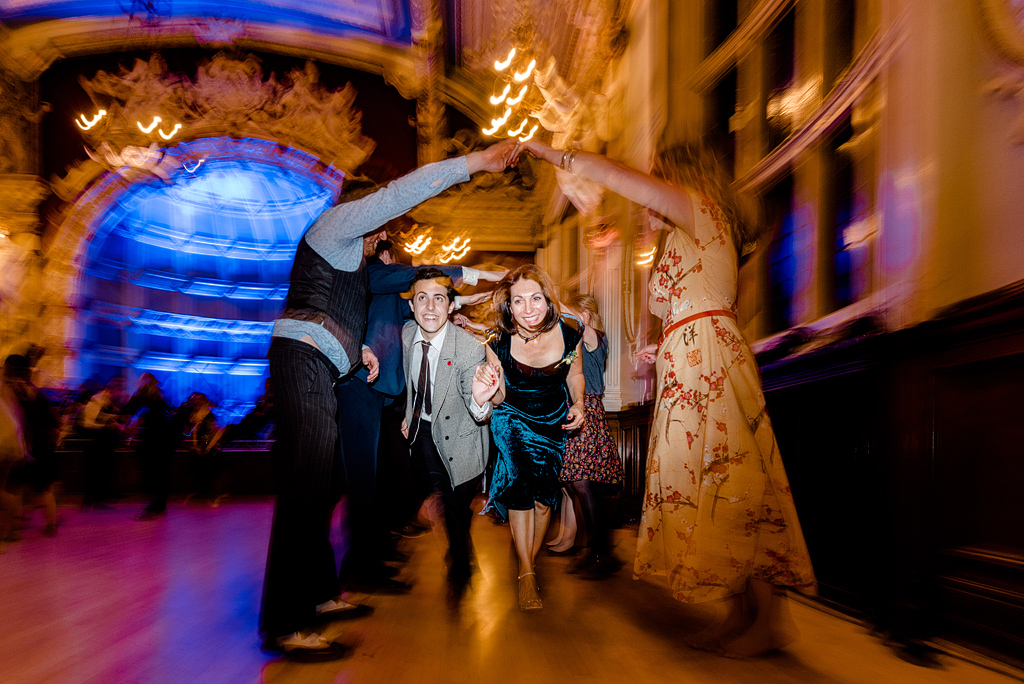 Guests running under tunnel of arms