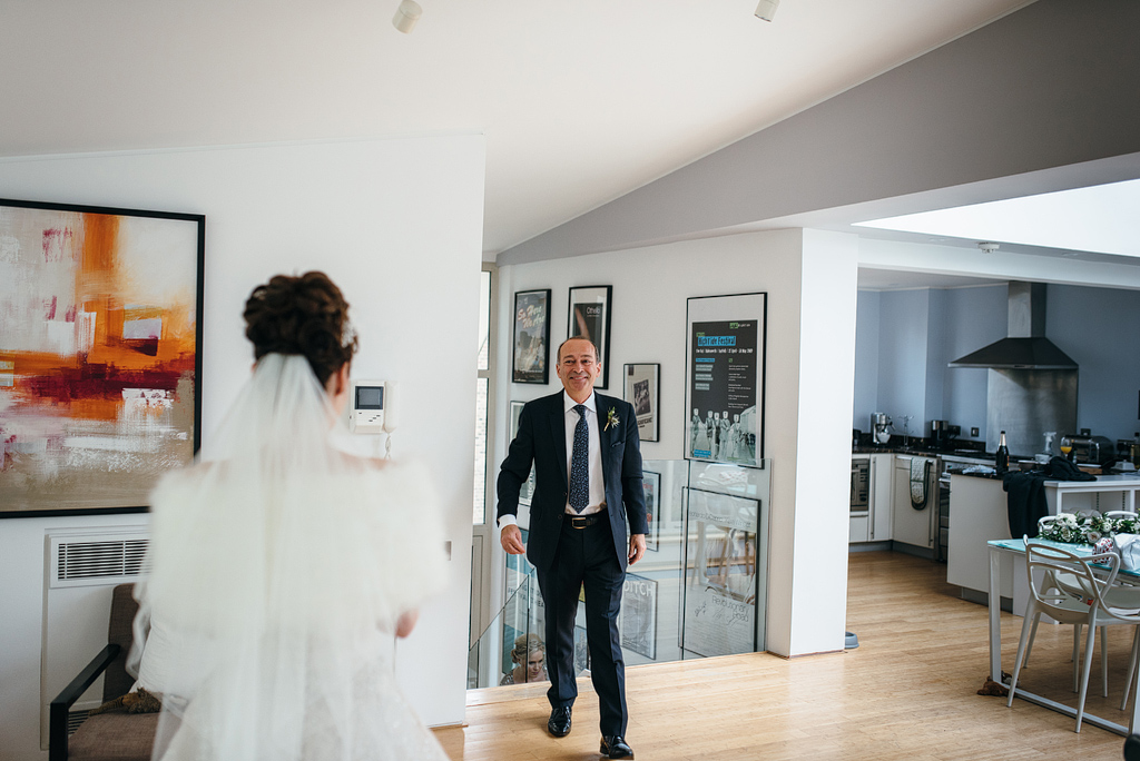 Father seeing bride in wedding dress