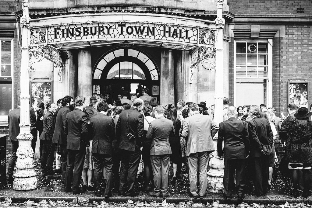 Wedding guests waiting outside Finsbury Town Hall