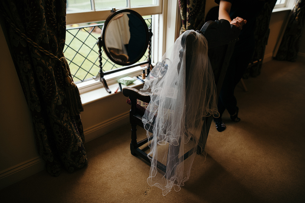 Bride's veil on chair awaiting wedding ceremony to begin