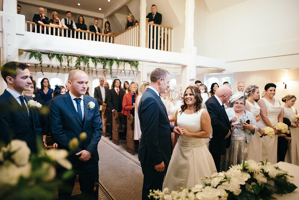 Bride and groom smiling at Orsett Hall Chapel