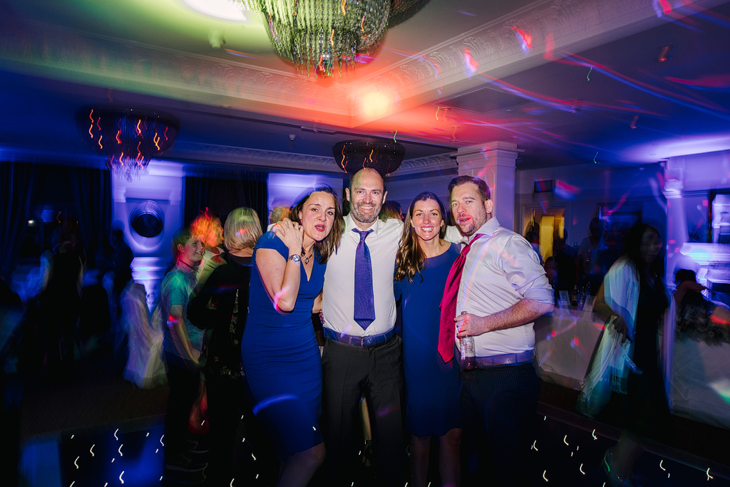Guests smiling on dance floor at Orsett Hall wedding