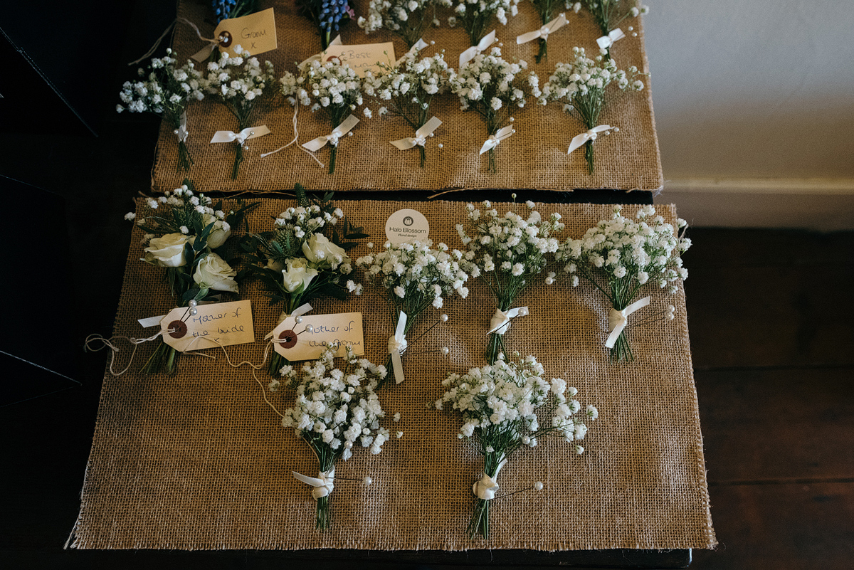 Bouquets laid out on table in preparation for wedding